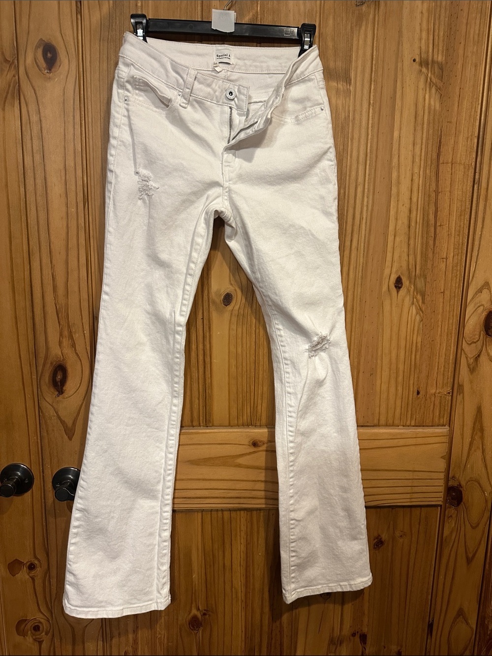 White Flare Jeans with Subtle Distress - Women's